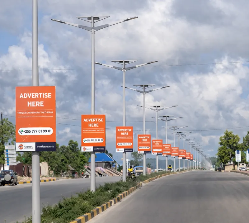 Street-pole advertising along a road in Paje